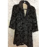 Black Persian Lamb coat with four black buttons (Saleroom location: on rail at S13)
