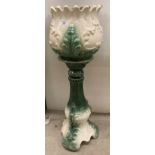Green and white pottery jardiniere on pedestal,