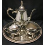 Four pieces silver plate three piece tea/coffee service and tray (Saleroom location: T11)