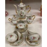 A West German miniature floral patterned coffee service (saleroom location: T02)