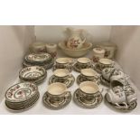 Contents to part of shelf - forty-two pieces of Johnson Bros Indian Tree pattern dinner service and