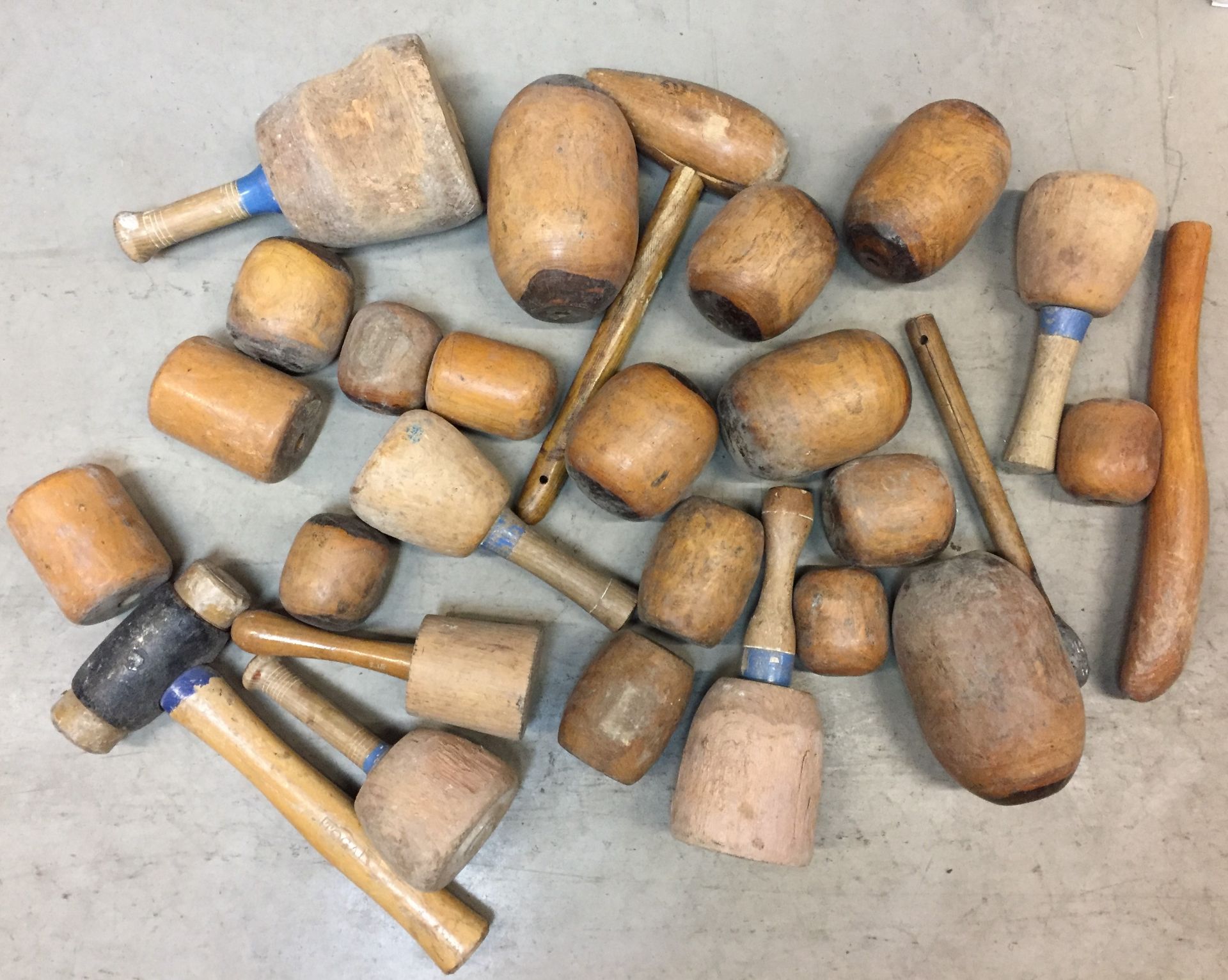 Twenty five plus wooden stone masons mallets (Saleroom location: S11 floor)