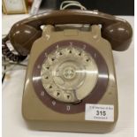 A vintage light brown plastic telephone no SPK N1900E244 (saleroom location: P08)