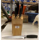 A wood knife block with five Taylor's Eye Witness kitchen knives (saleroom location: X13)