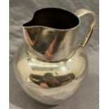 Silver jug 15cm high possibly hallmarked London 1892 (hallmark faded - weight 9.