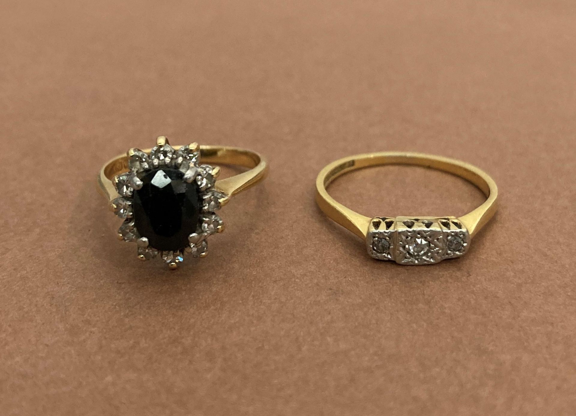 Two 18ct gold rings - an 18ct gold sapphire and diamond ring (size L/M, weight 3.