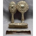 Four piece silver bedroom set (hall marked Birmingham 1959) including hand held mirror, hair brush,