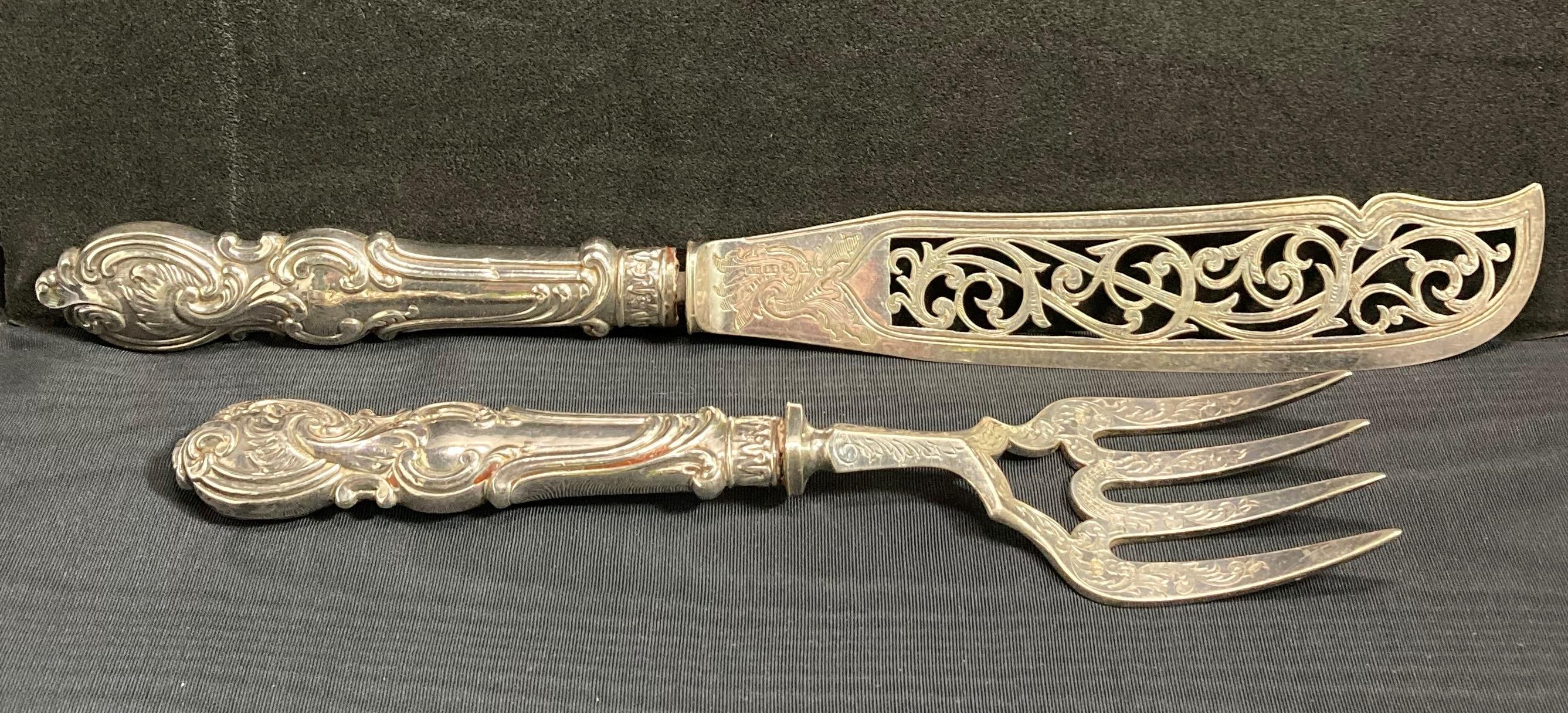 Carving set with silver hallmarked handles (possibly Sheffield late 18th century) with engraved and