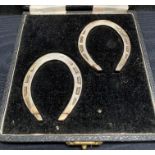 Two silver horse shoes (hall marked Sheffield 1950) in case (total weight 2.