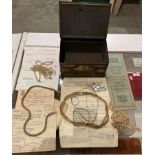 Contents to tin - assorted costume jewellery - necklaces and one brooch and assorted ephemera -