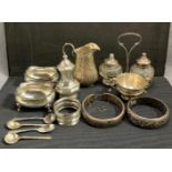 Eleven sterling silver items including mustard pots, small jug, small trophy, two bangles,