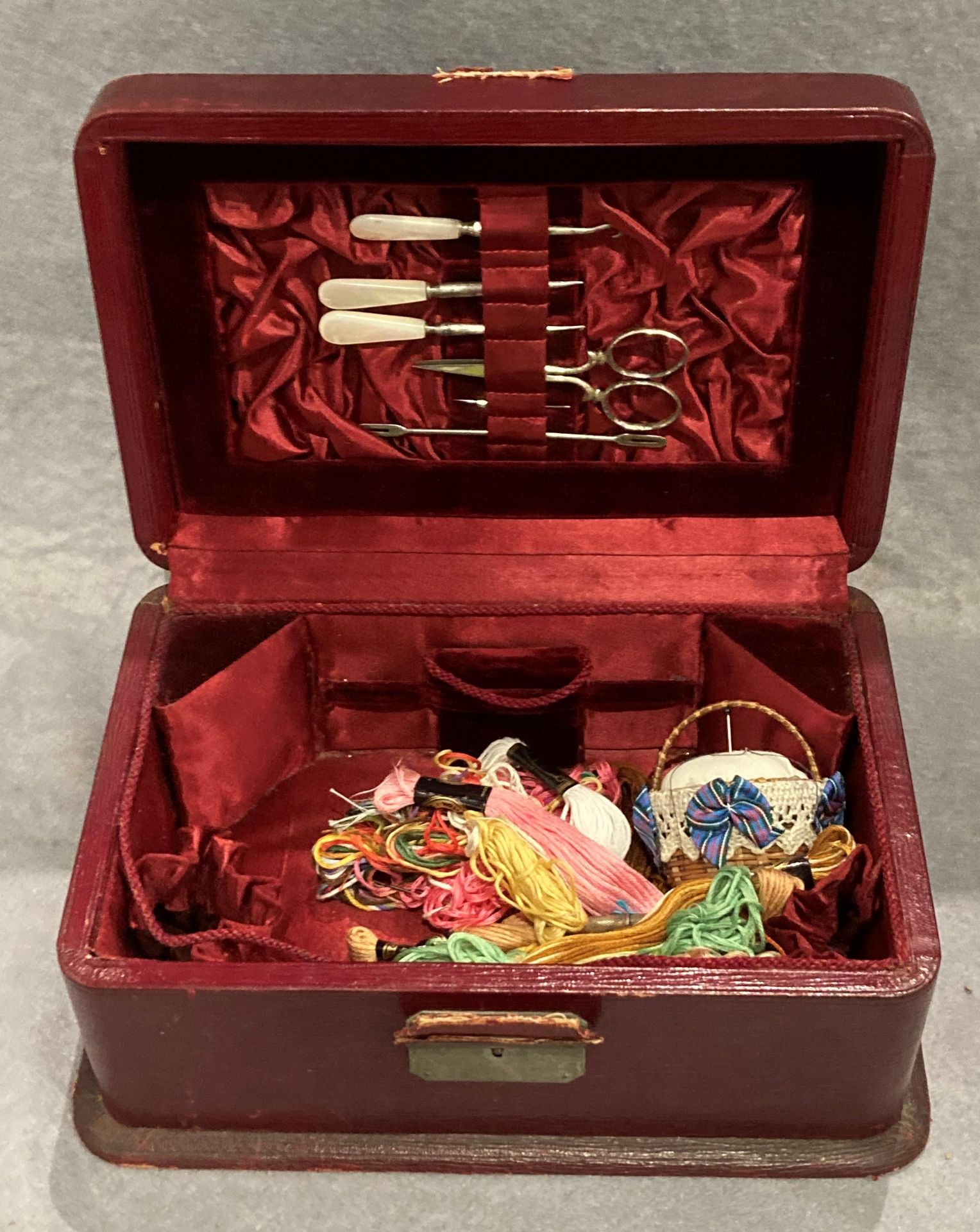 A red leather sewing box - red velvet and silk lining with tools to lid and needle case 9½" x 6½" x