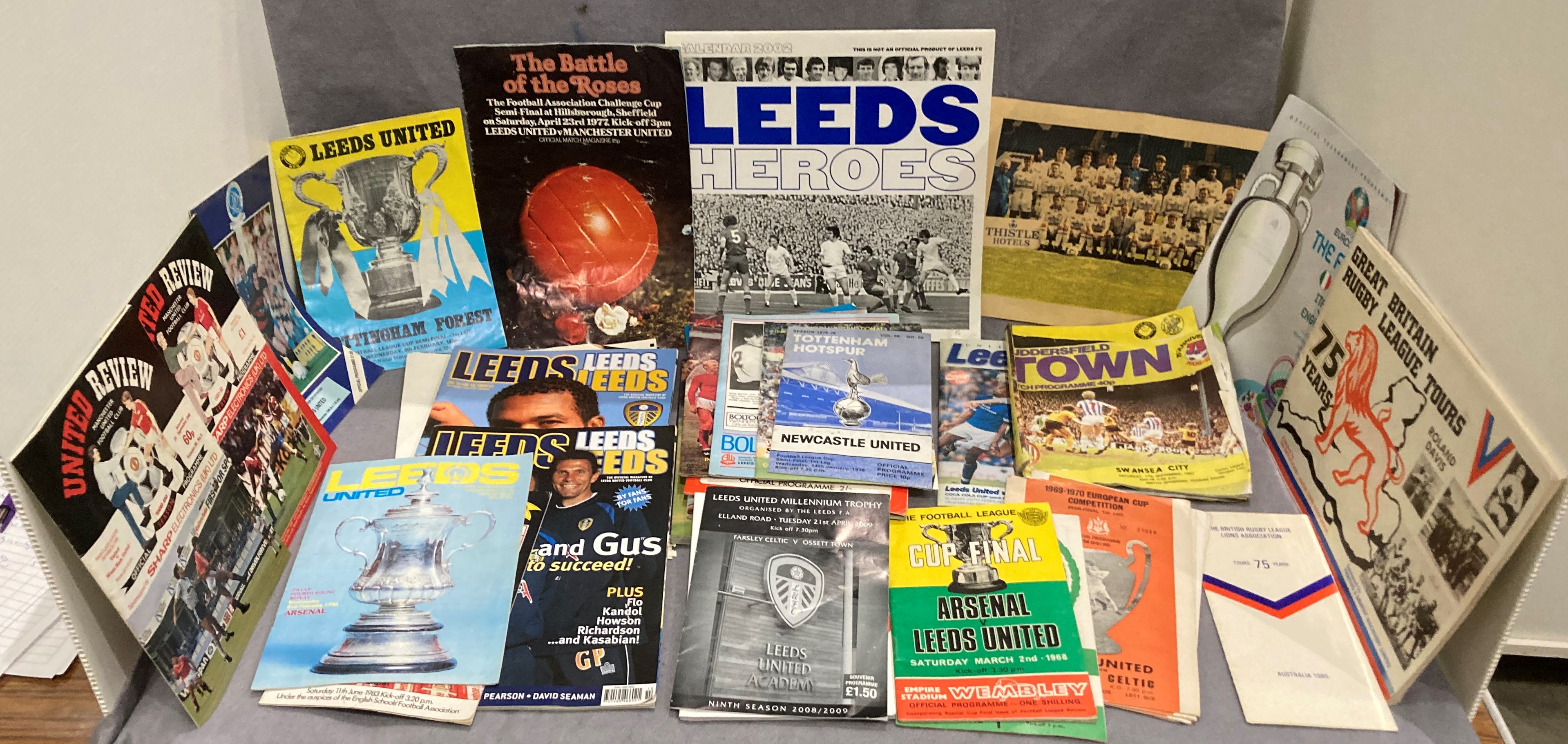 Contents to tray - an interesting collection of Leeds United and other Cup programmes including