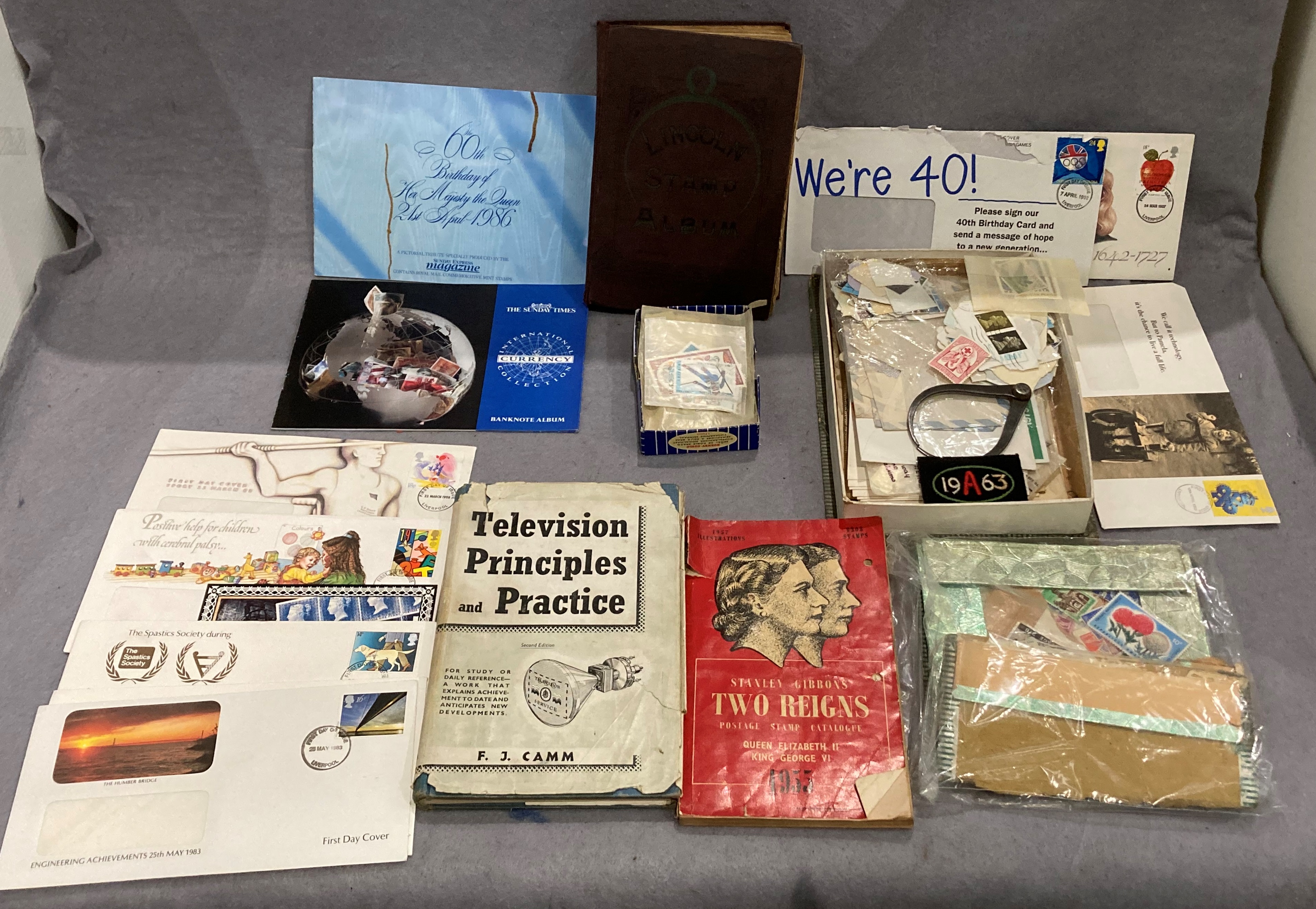 Contents to tray - a small Lincoln and a Rapid stamp album and contents, World stamps,