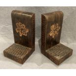 A pair of wood and leather bookends.