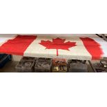 A Canadian Merchant Shipping flag 80cm x 150cm - (slight tears due to constant flapping in the wind