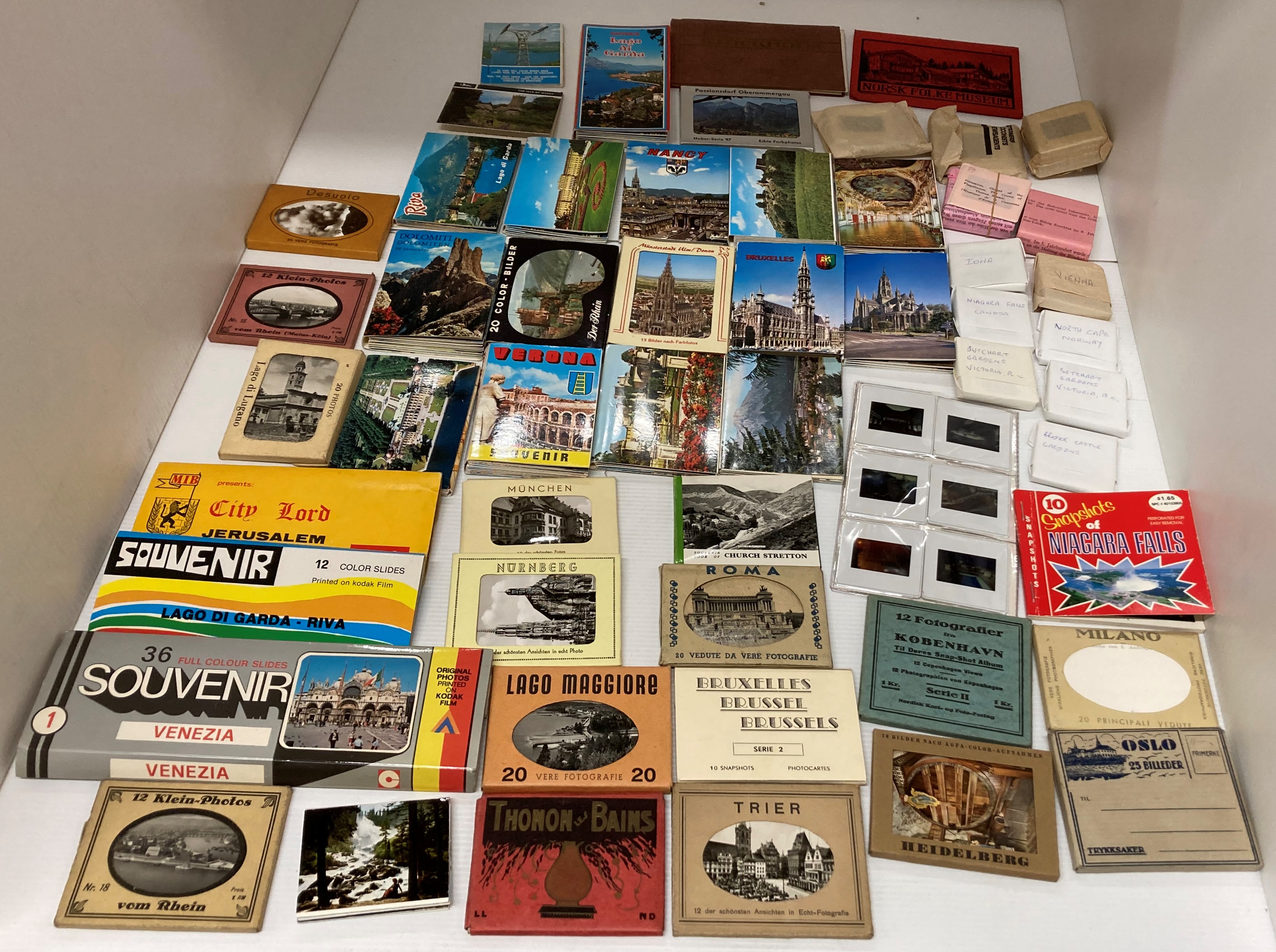Contents to box - fifty tourist mini postcard photo wallets GB and Europe,