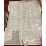 A rolled up copy of The Times,