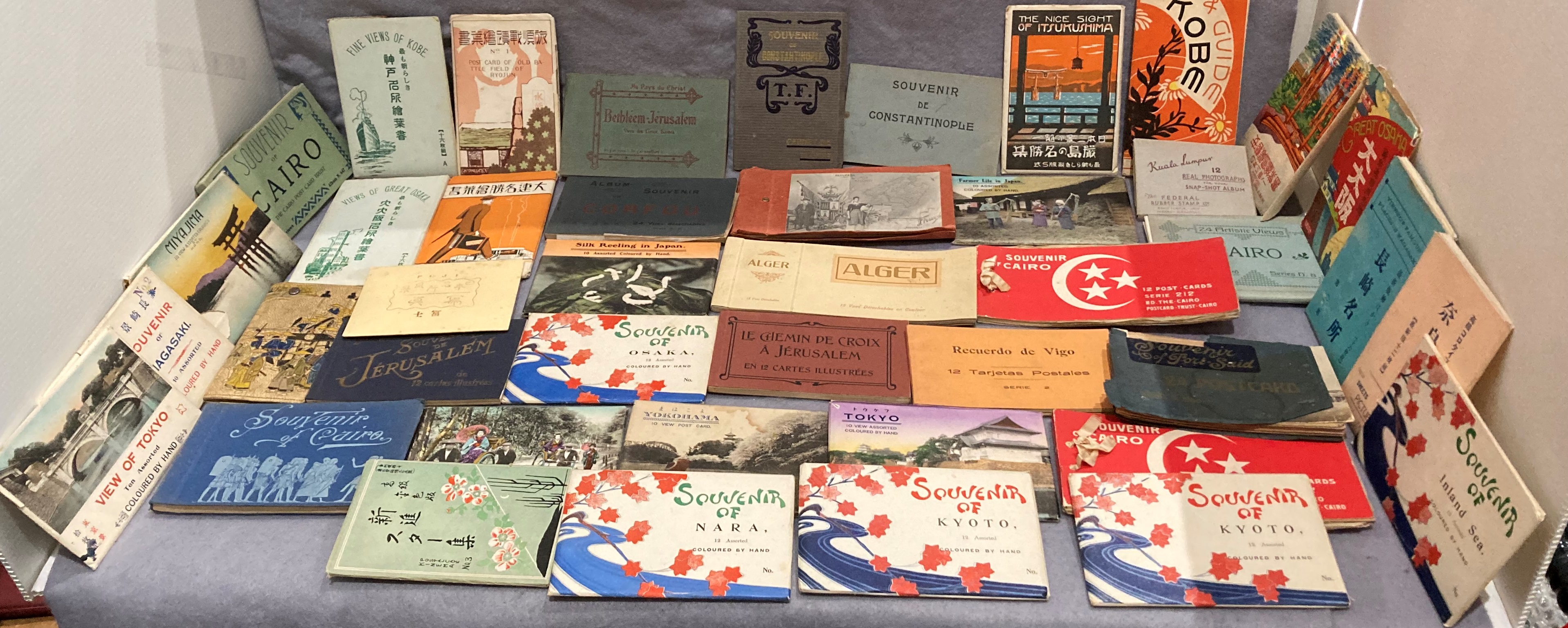 Contents to tray - 38 souvenir postcard albums including Corfu, Constantinople, Port Said, Cairo,