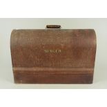 A vintage wooden cased Singer sewing machine (case locked,