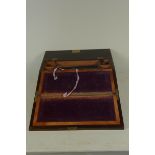 A 19th Century rosewood and mother of pearl inlaid slope front writing box with interior