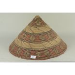 An oriental coloured straw hat