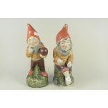 A pair of Edwardian painted pottery garden gnomes,