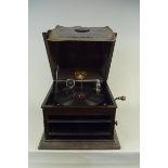 A Columbia Grafonola oak cased wind up gramophone with a 78 record and two needle tins