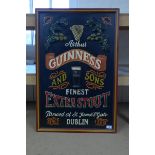 A 20th Century hand painted wooden advertising sign for Guinness