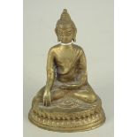A seated brass Buddha