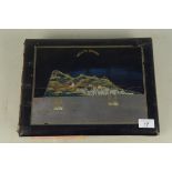 A postcard album of Gibraltar with lacquered cover with mother of pearl inlaid views of the rock