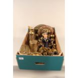 A box of mixed brass ware including Titanic bell and celluloid head sailor figure