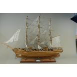 A large handmade (from kit) wooden model of The Cutty Sark mounted on wooden base, fully rigged,