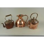 Two Victorian seamed copper kettles (one circular and one oval) plus a one gallon copper harvest