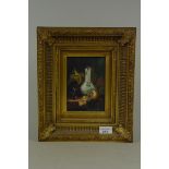 A still life on panel in the Dutch style in a swept gilt frame, signed 'Nadiner',