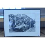 A framed photograph, the 1954 Monza Grand Prix change over of Ferrari drivers (N.B.