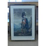 A framed print of a highland clan chief after H Macbeth Raeburn, printed in 1937 by Henry Stott,