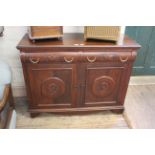 A 20th Century carved mahogany two door two drawer sideboard