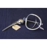 A mixed lot comprising of a 20th Century anaesthetic face mask frame plus a titanium hip ball joint,