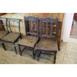 A pair of late 19th Century carved oak stretcher chairs