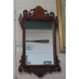 A late 18th Century walnut mirror