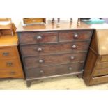 An early 19th Century mahogany five drawer chest on bracket feet