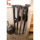 Four mid 20th Century steel wall mounted candle holders,