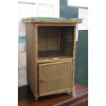 A Lloyd loom bedside cabinet