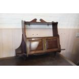 An Edwardian two door mahogany hanging cupboard