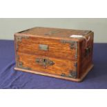 A late 19th Century nickel mounted oak jewellery casket of rectangular form with hinged cover to a