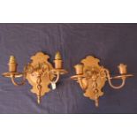 A pair of 20th Century cast copper electrical two light wall sconces,
