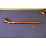 A 19th Century Fijian gun stock war club of typical form with matted head and plain shaft and