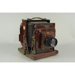An early 20th Century mahogany and lacquered brass field camera,