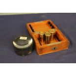 A mixed lot comprising two of four brass cased microscope objectives by Carl Zeiss (Jena) in a